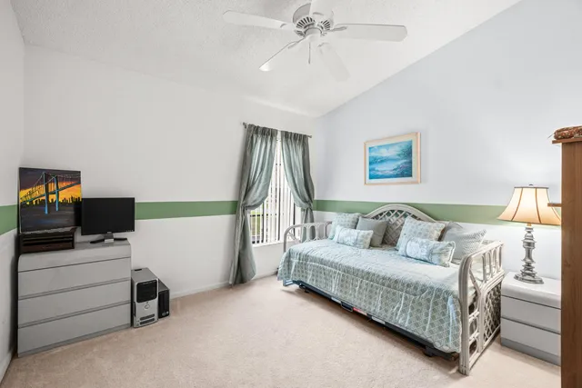 a view of a livingroom with furniture and a ceiling fan