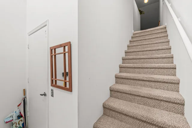 an aerial view of a house with a garden and deck