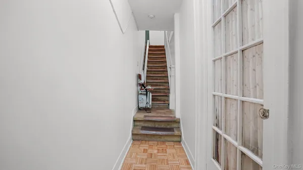 a view of a hallway with stairs