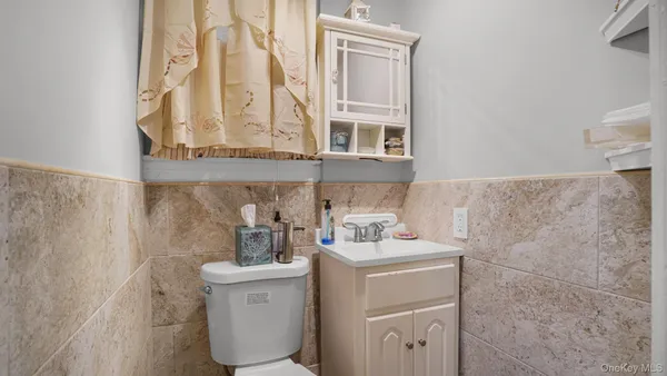 a bathroom with a sink toilet and vanity