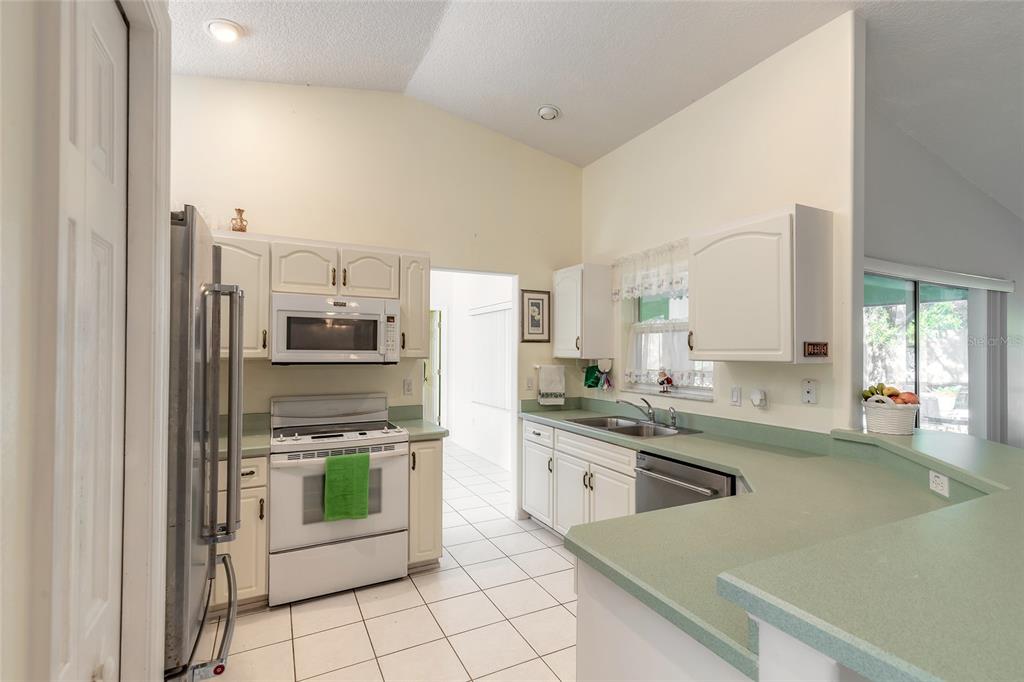 39 Princess Ruth Lane Palm Coast, FL 32164 - Photo 11 of 48 a kitchen with stainless steel appliances a stove sink and cabinets