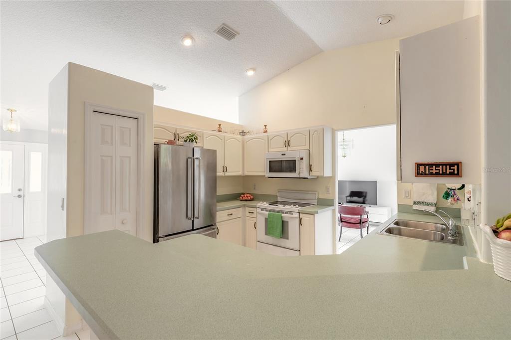 39 Princess Ruth Lane Palm Coast, FL 32164 - Photo 12 of 48 a open kitchen with stainless steel appliances granite countertop a refrigerator and a stove