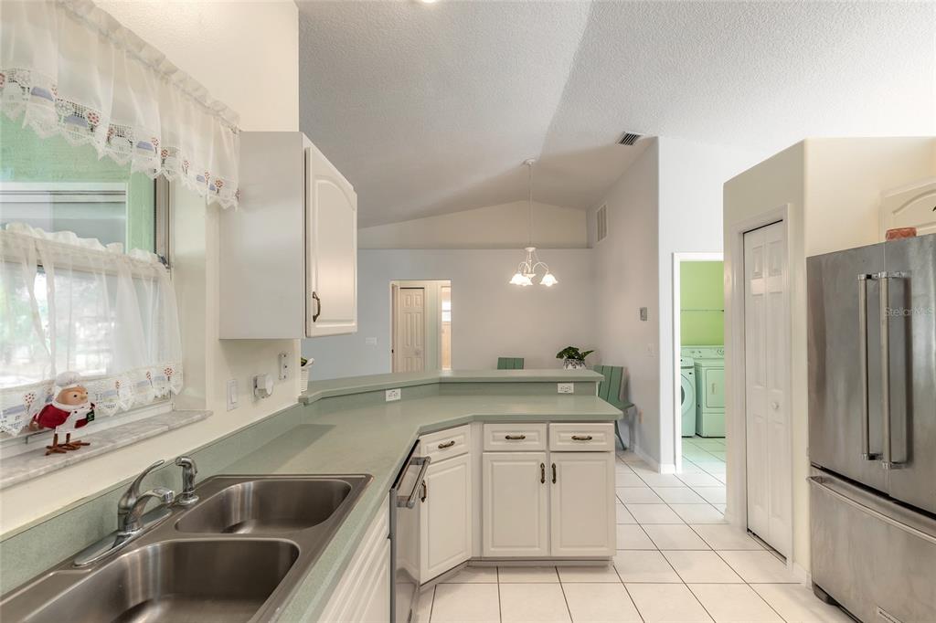 39 Princess Ruth Lane Palm Coast, FL 32164 - Photo 14 of 48 a kitchen with a sink stove and refrigerator