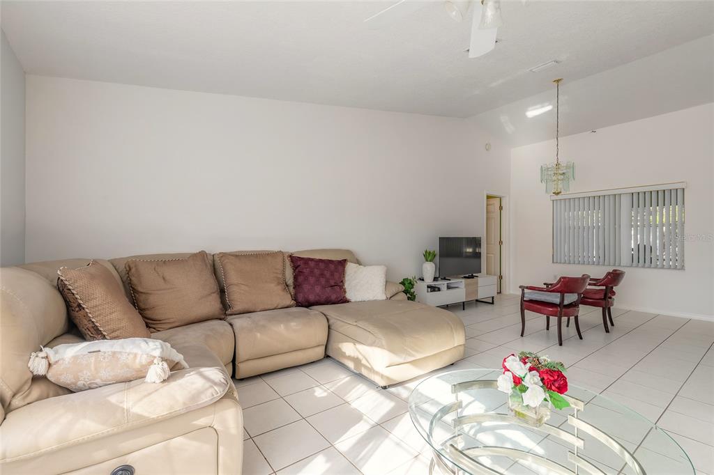 39 Princess Ruth Lane Palm Coast, FL 32164 - Photo 18 of 48 a living room with furniture rug and outdoor view