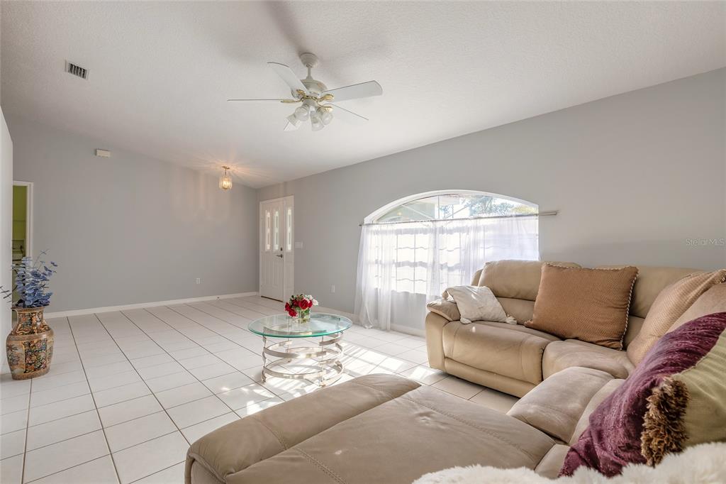 39 Princess Ruth Lane Palm Coast, FL 32164 - Photo 19 of 48 a living room with furniture and a large window