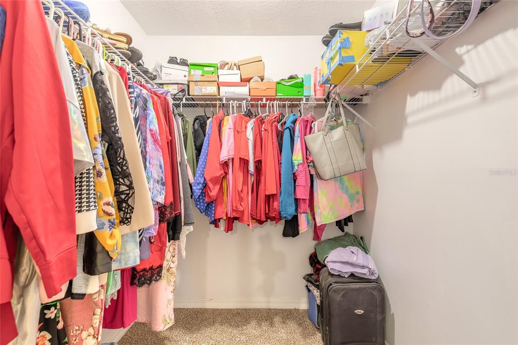 39 Princess Ruth Lane Palm Coast, FL 32164 - Photo 28 of 48 a view of walk in closet with clothes