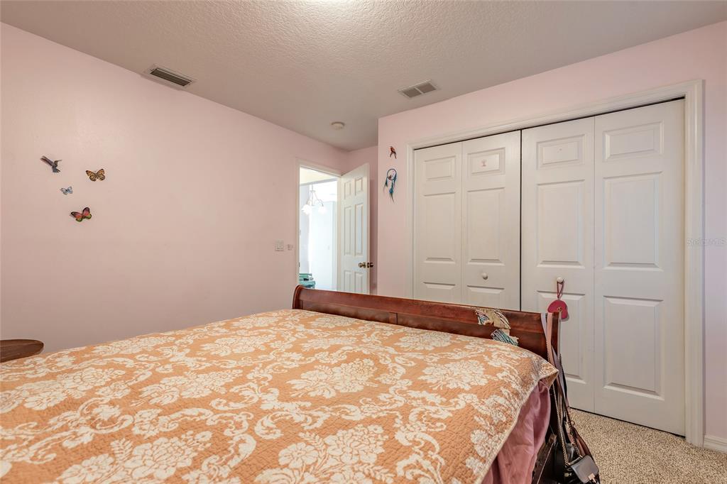 39 Princess Ruth Lane Palm Coast, FL 32164 - Photo 30 of 48 a bedroom with a bed and a closet