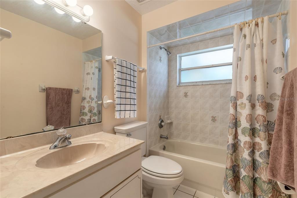 39 Princess Ruth Lane Palm Coast, FL 32164 - Photo 31 of 48 a bathroom with a granite countertop sink toilet and shower