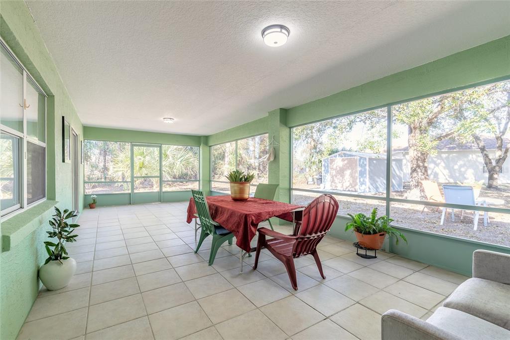 39 Princess Ruth Lane Palm Coast, FL 32164 - Photo 34 of 48 a outdoor living space with furniture and garden view