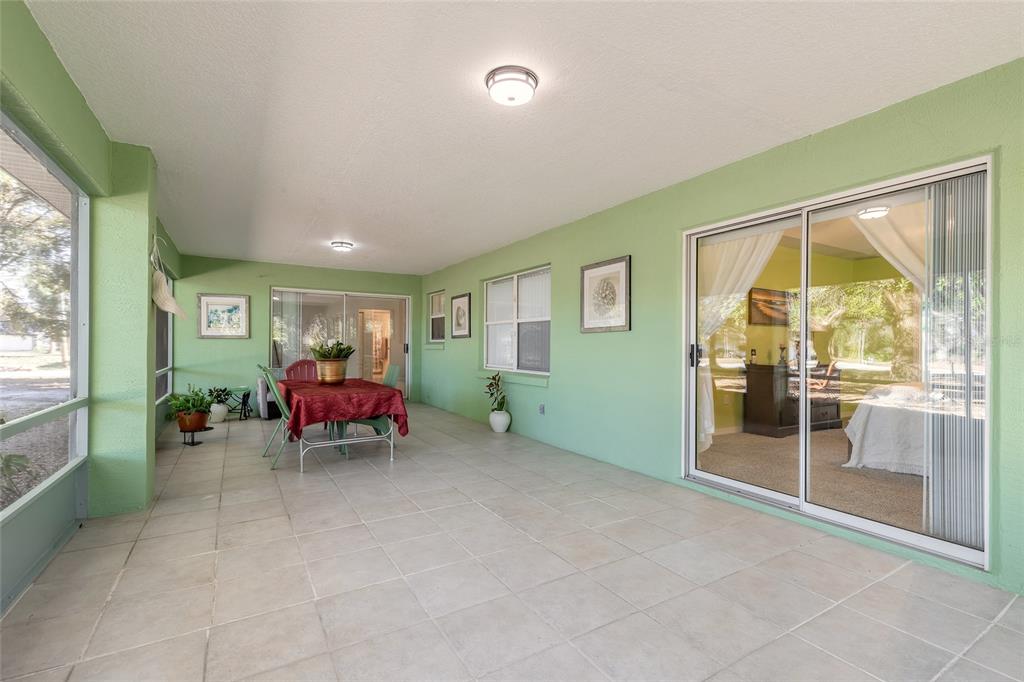 39 Princess Ruth Lane Palm Coast, FL 32164 - Photo 35 of 48 a living room with furniture and a large window
