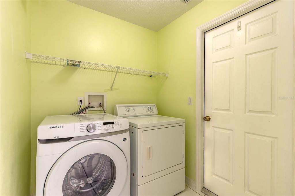 39 Princess Ruth Lane Palm Coast, FL 32164 - Photo 36 of 48 a utility room with dryer and washer