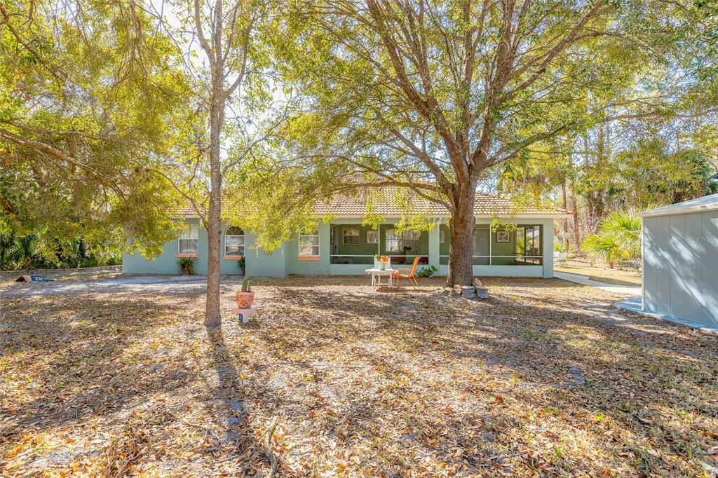 39 Princess Ruth Lane Palm Coast, FL 32164 - Photo 39 of 48 a view of a house with backyard and trees