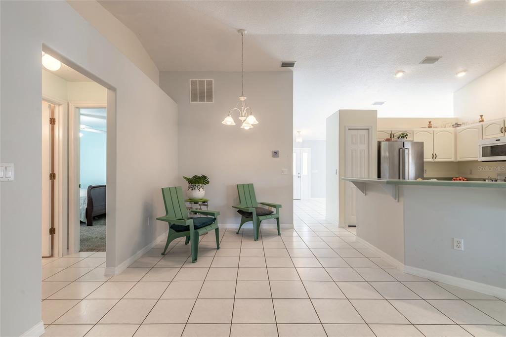 39 Princess Ruth Lane Palm Coast, FL 32164 - Photo 5 of 48 a view of a dining room with furniture