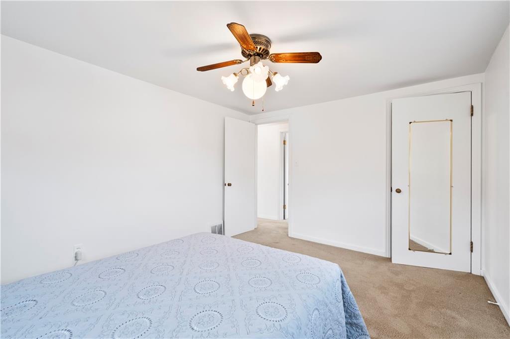 152 Valley Avenue Monongahela, PA 15063 - Photo 15 of 32 a bedroom with a chandelier fan and a ceiling fan