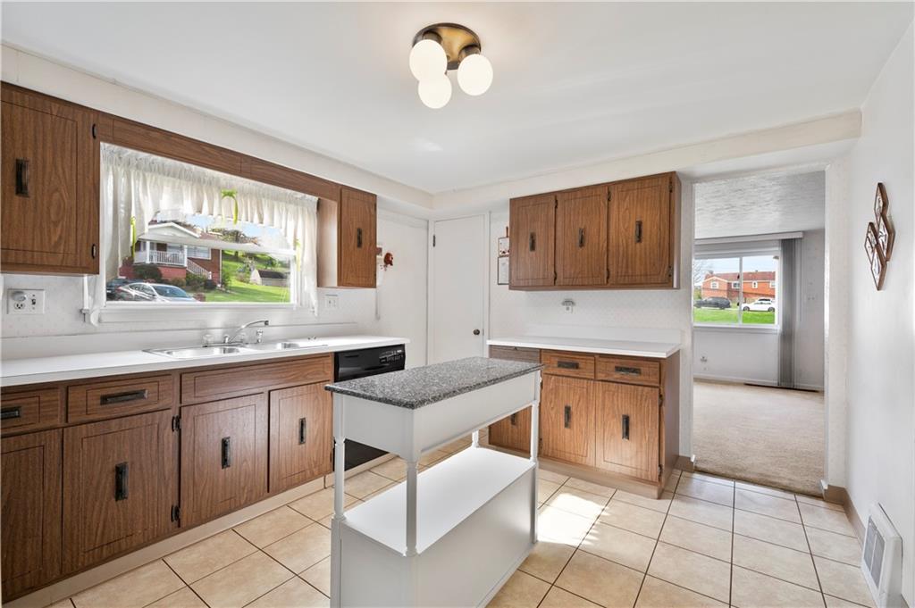 152 Valley Avenue Monongahela, PA 15063 - Photo 6 of 32 a kitchen with granite countertop a sink cabinets and window