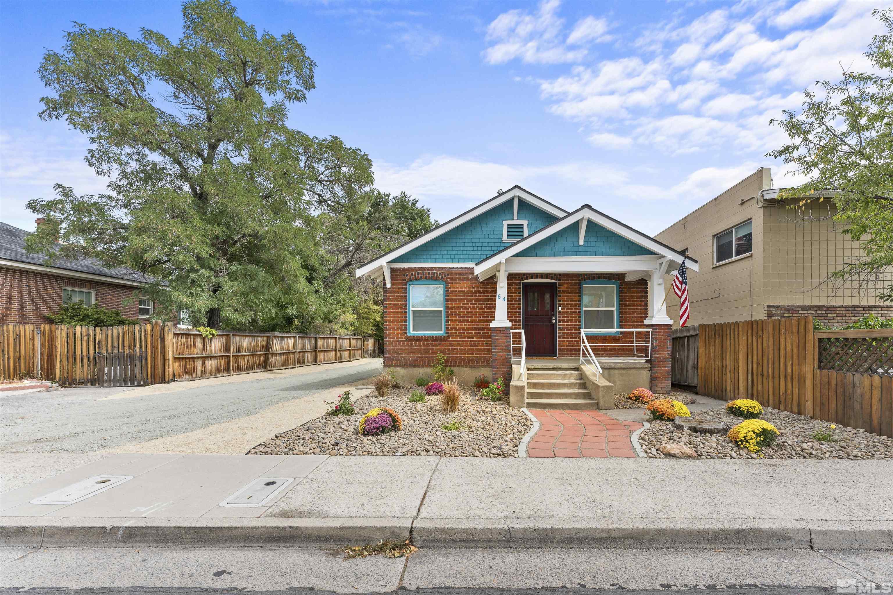 64 Keystone Avenue, Unit 6466 KEYSTONE AVENUE Reno, NV 89503 - Photo 1 of 36 a front view of a house with a tree