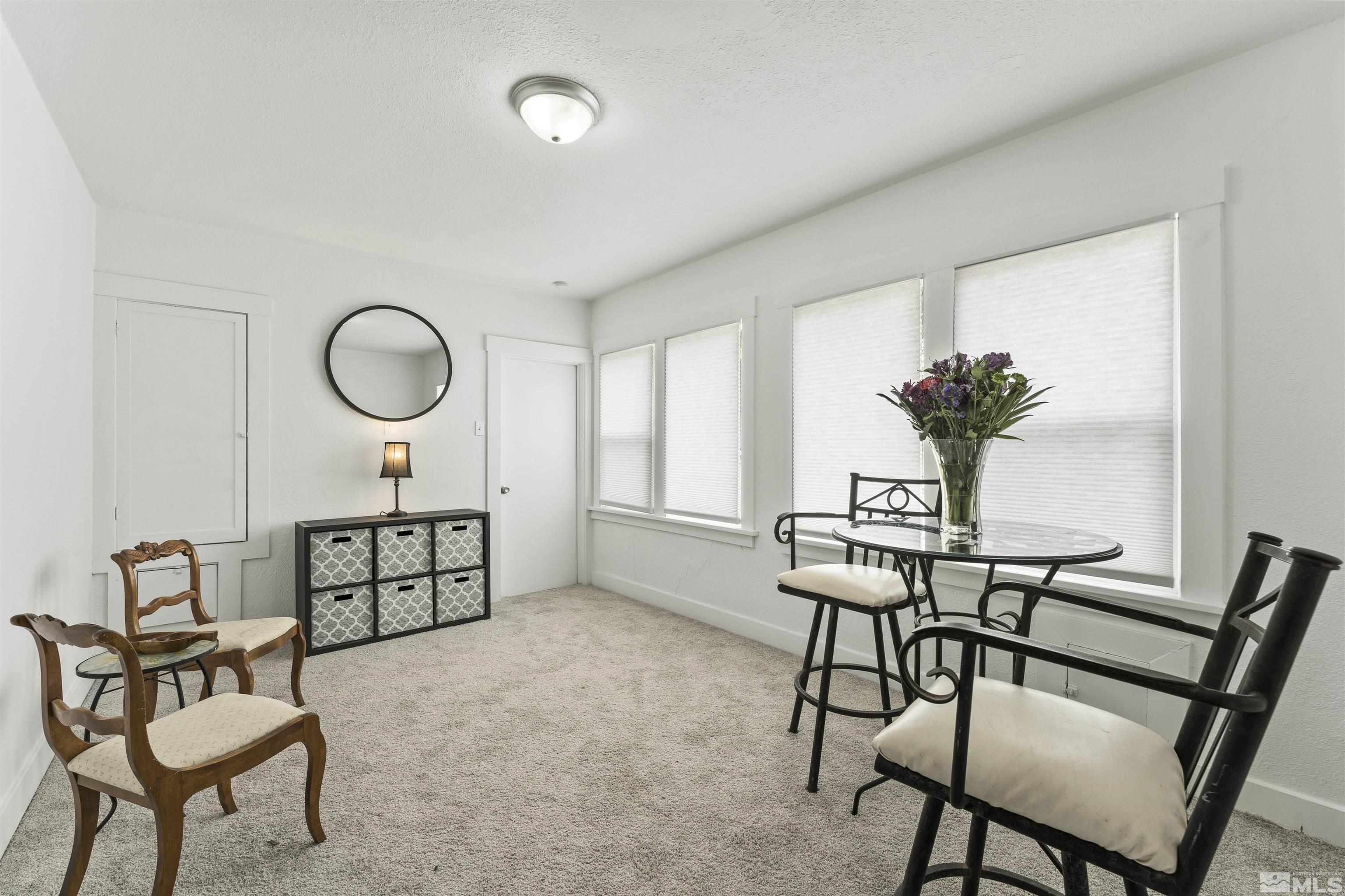 64 Keystone Avenue, Unit 6466 KEYSTONE AVENUE Reno, NV 89503 - Photo 14 of 36 a view of a livingroom with furniture and white walls