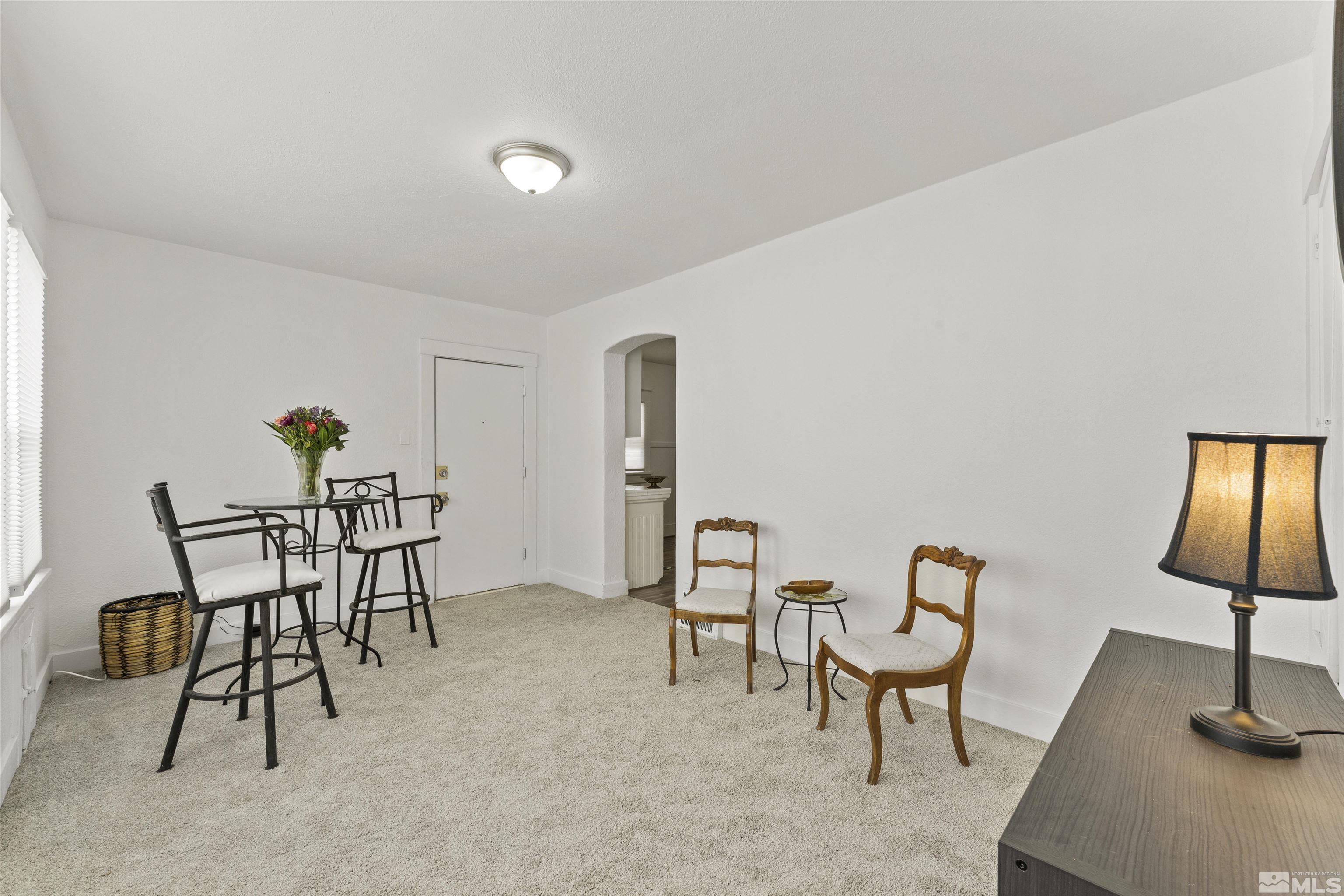 64 Keystone Avenue, Unit 6466 KEYSTONE AVENUE Reno, NV 89503 - Photo 16 of 36 a view of a livingroom with furniture and a chair