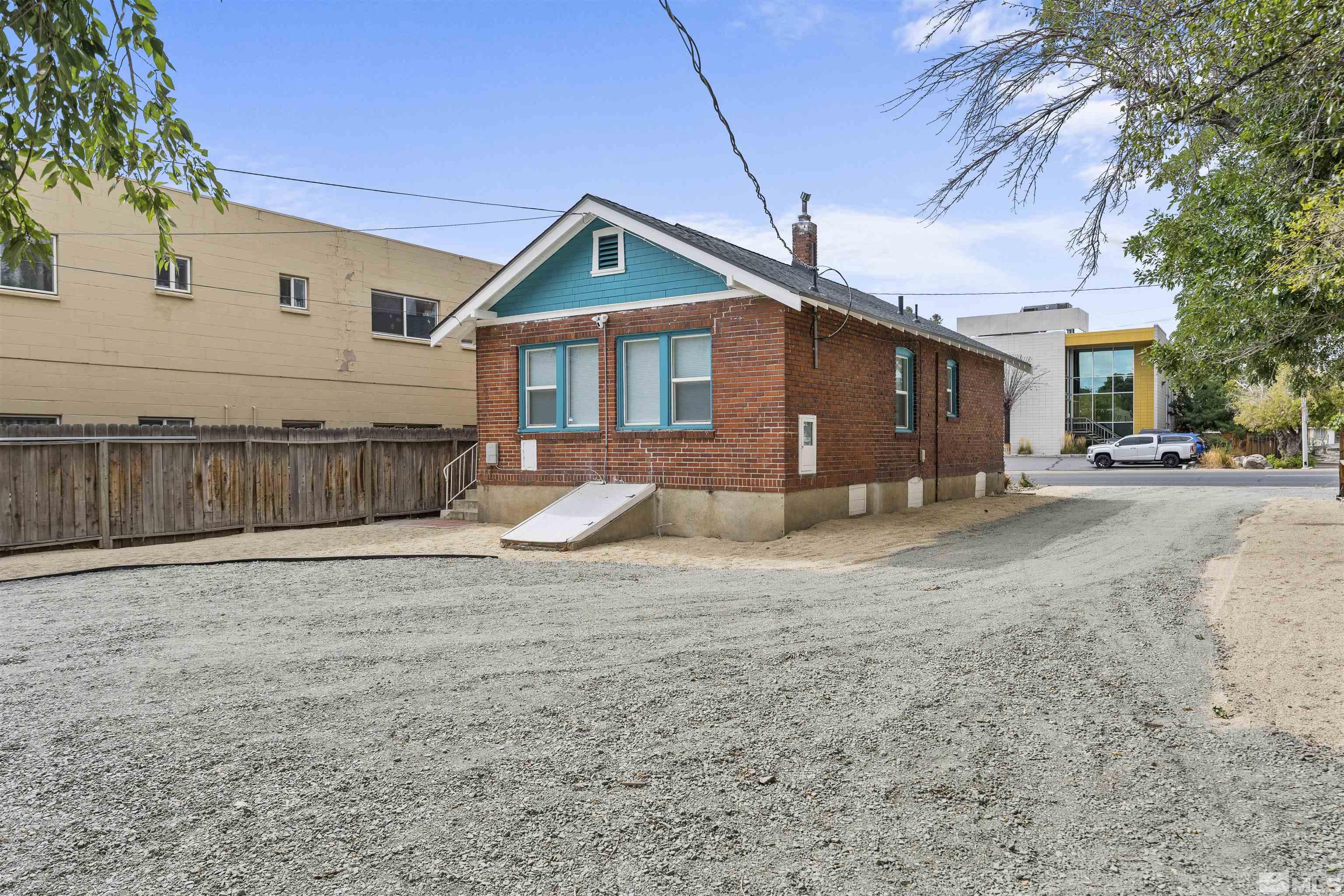 64 Keystone Avenue, Unit 6466 KEYSTONE AVENUE Reno, NV 89503 - Photo 20 of 36 a front view of a house with a yard