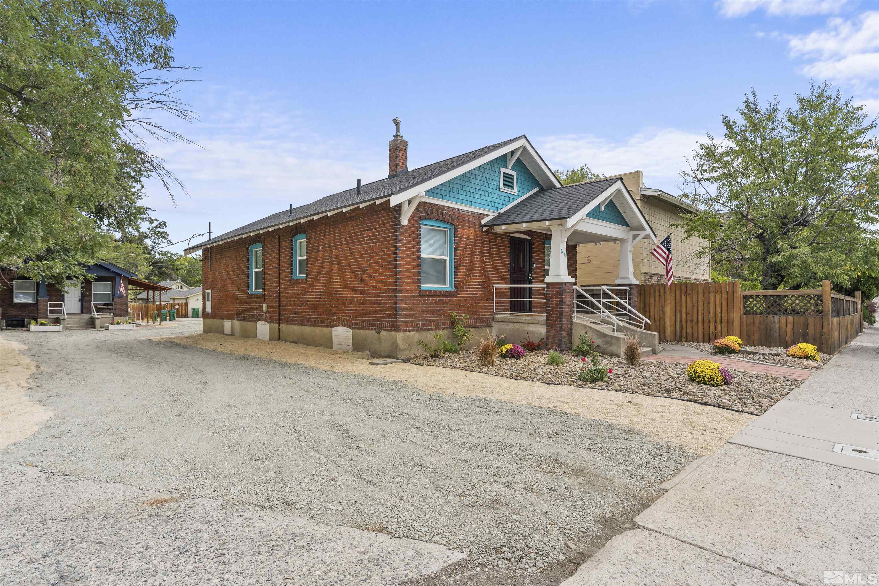 64 Keystone Avenue, Unit 6466 KEYSTONE AVENUE Reno, NV 89503 - Photo 2 of 36 a view of a blue house with wooden fence