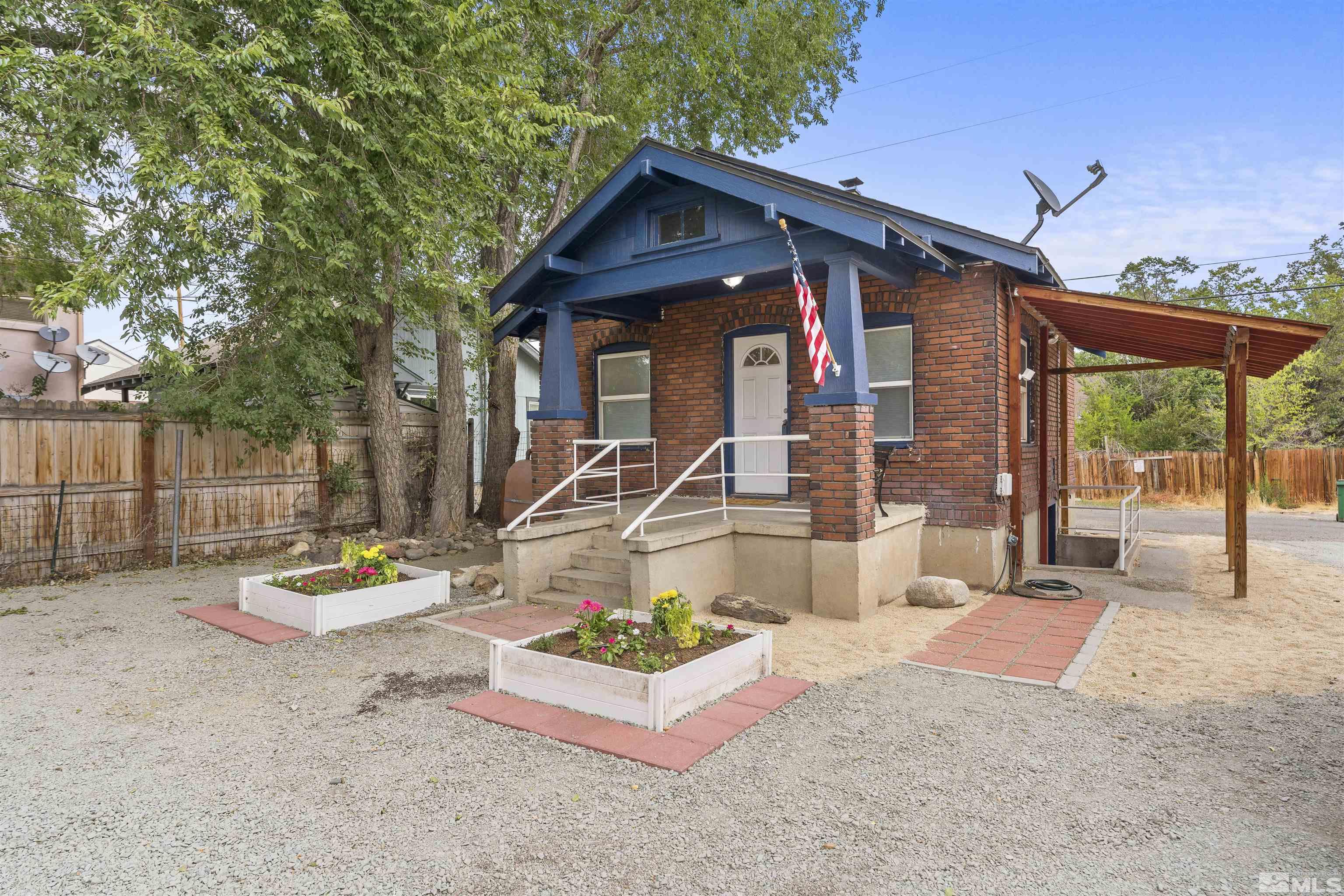 64 Keystone Avenue, Unit 6466 KEYSTONE AVENUE Reno, NV 89503 - Photo 23 of 36 a front view of a house with garden
