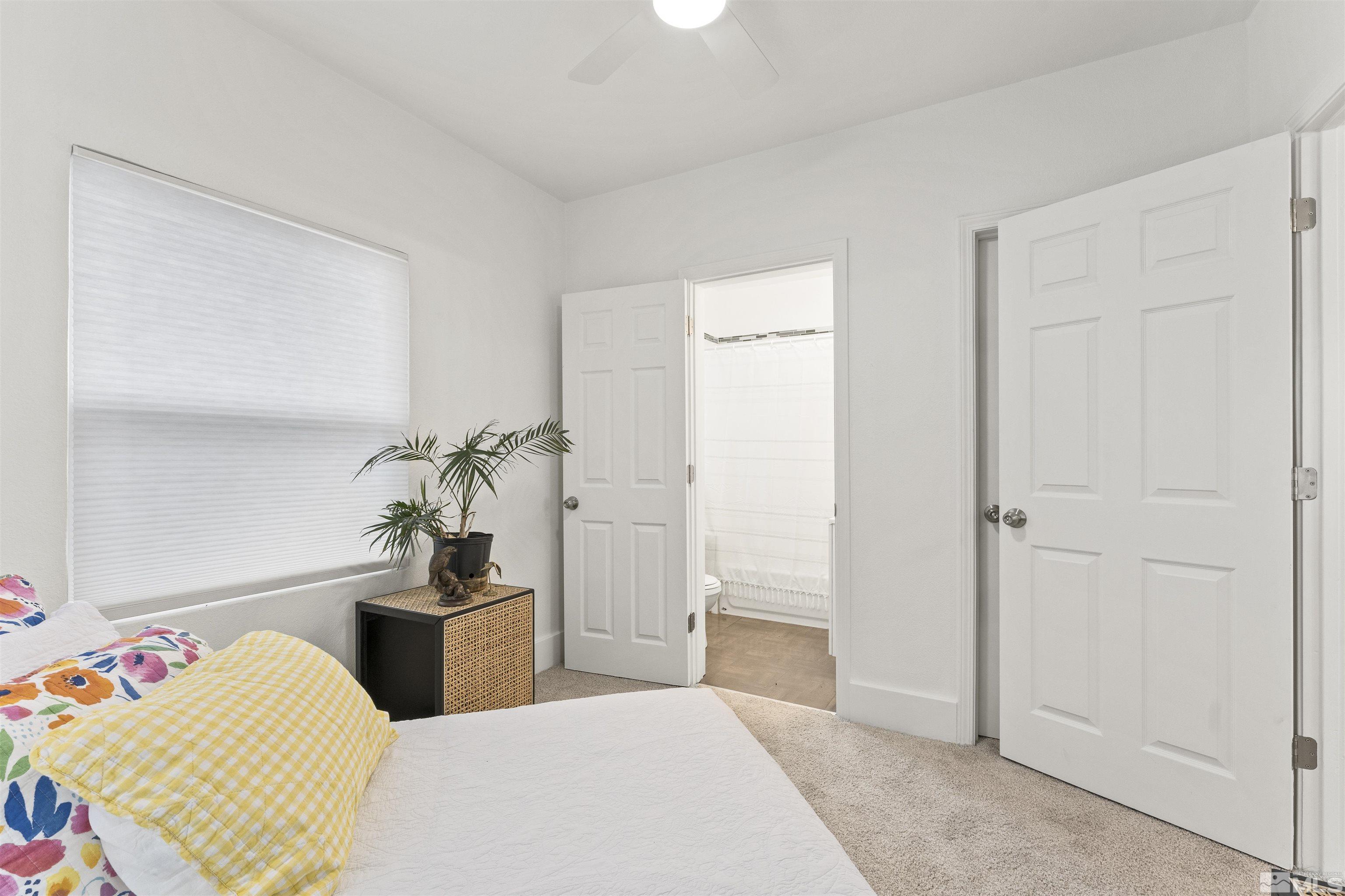 64 Keystone Avenue, Unit 6466 KEYSTONE AVENUE Reno, NV 89503 - Photo 32 of 36 a bedroom with furniture and a potted plant
