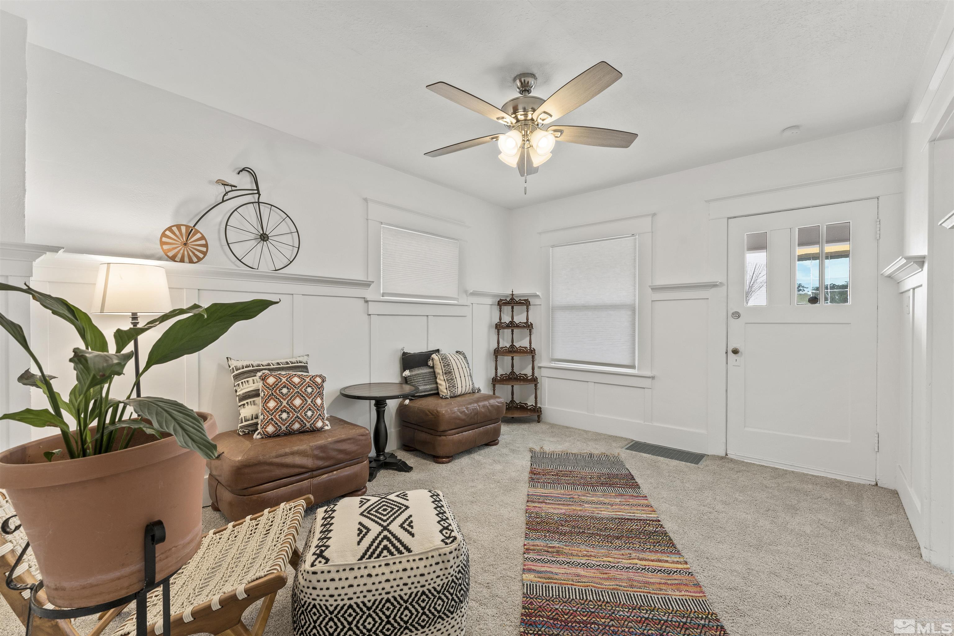 64 Keystone Avenue, Unit 6466 KEYSTONE AVENUE Reno, NV 89503 - Photo 5 of 36 a living room with furniture and a chandelier