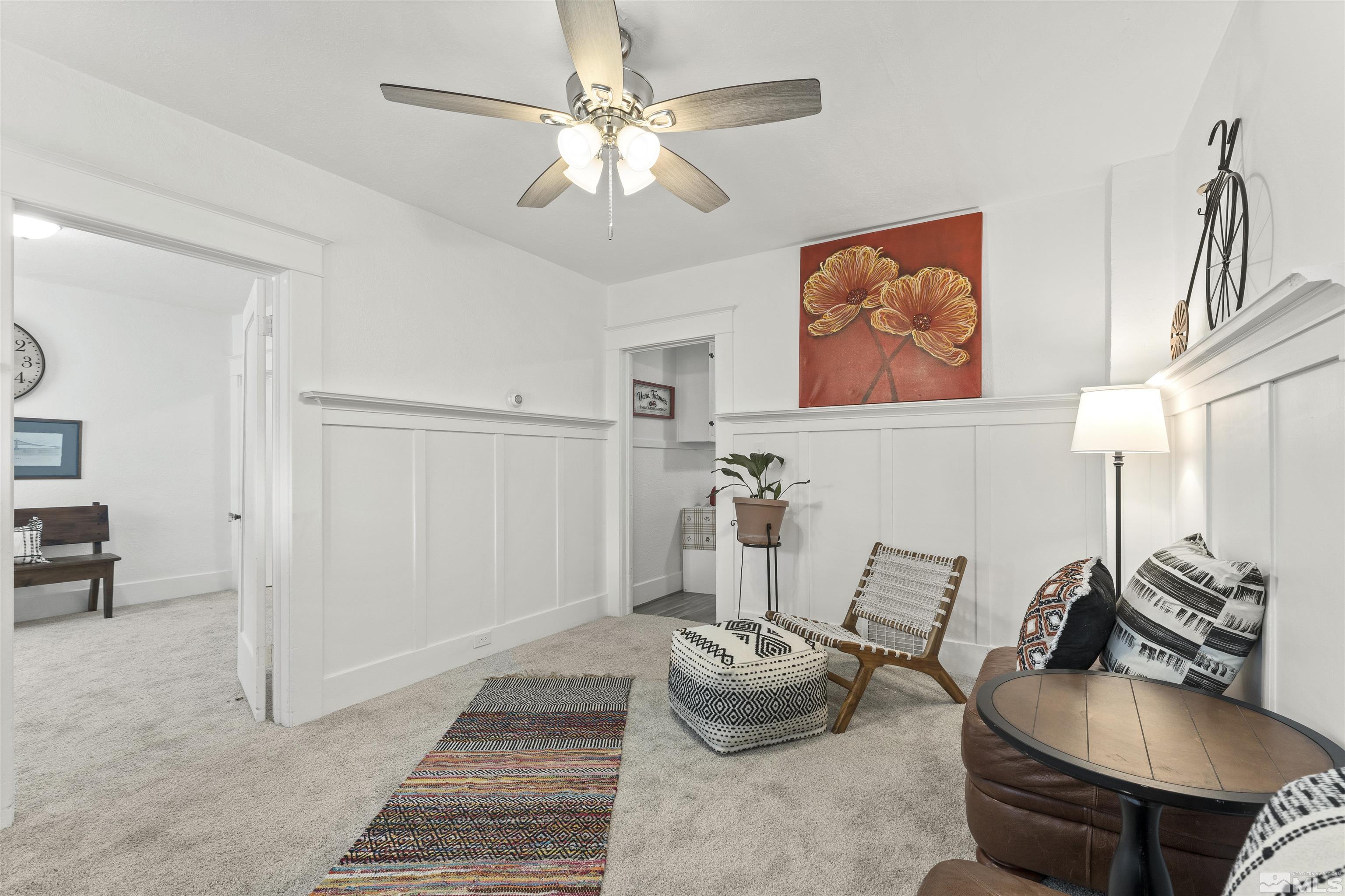 64 Keystone Avenue, Unit 6466 KEYSTONE AVENUE Reno, NV 89503 - Photo 6 of 36 a room with furniture a rug and a chandelier