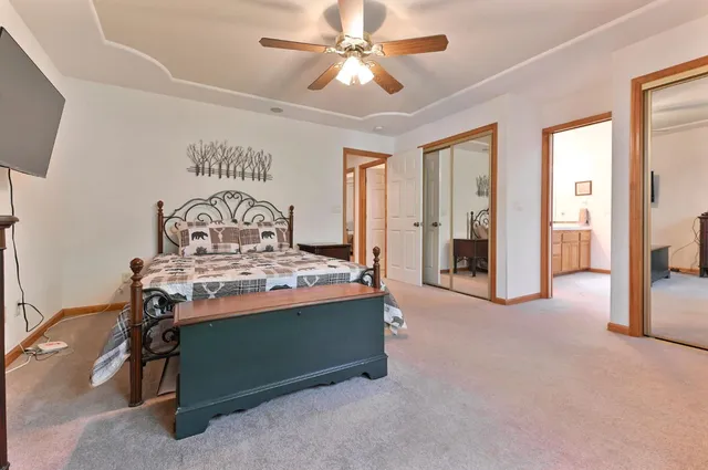 a view of a livingroom with a chandelier fan