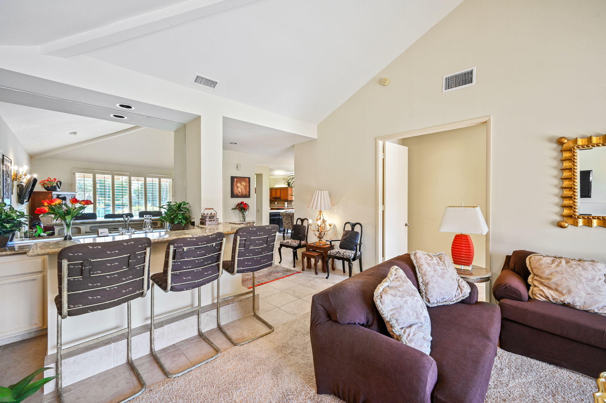 151 Lakeshore Drive Rancho Mirage, CA 92270 - Photo 12 of 37 a living room with furniture and a large window