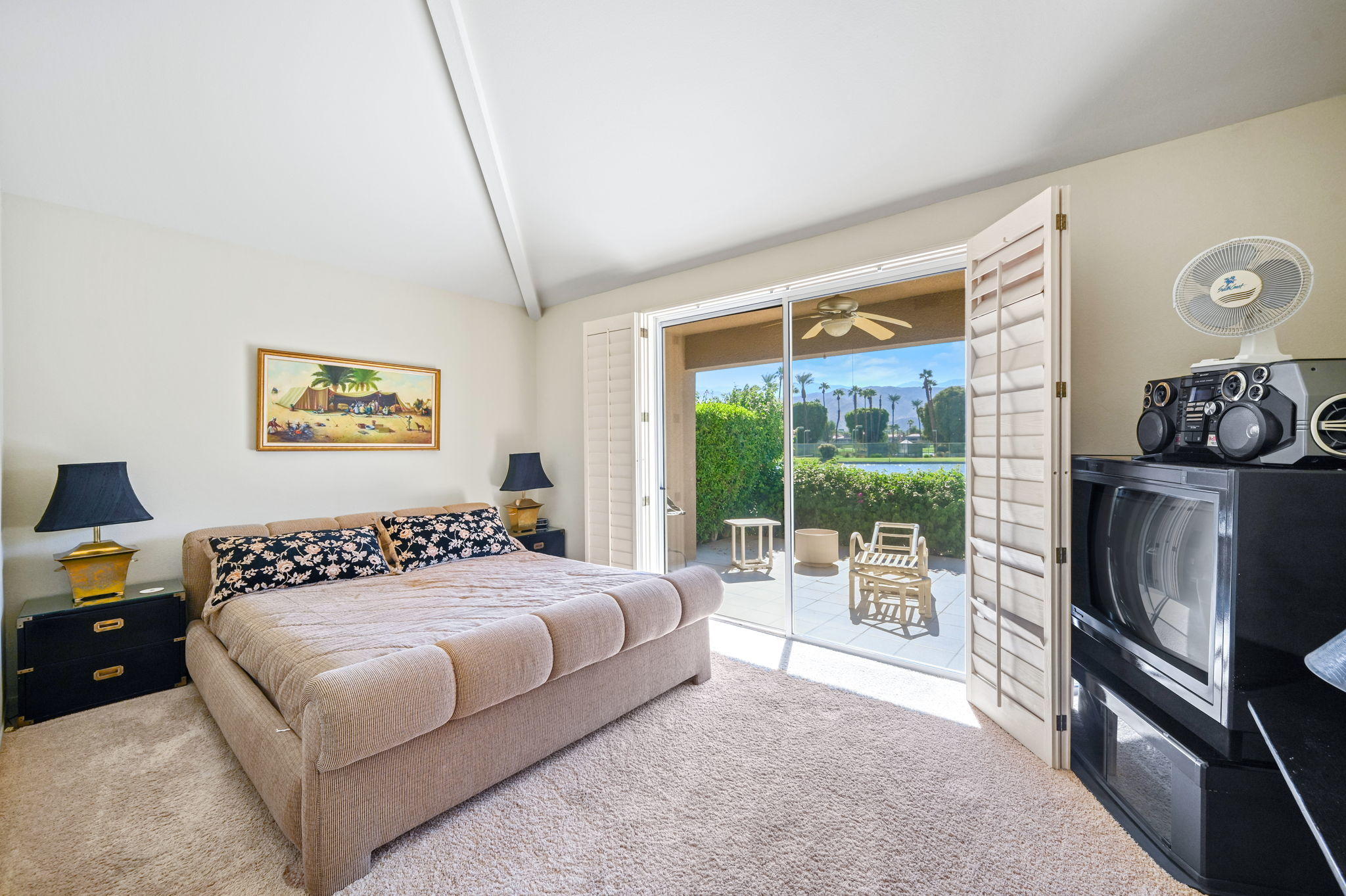 151 Lakeshore Drive Rancho Mirage, CA 92270 - Photo 13 of 37 a bedroom with a bed and a large window