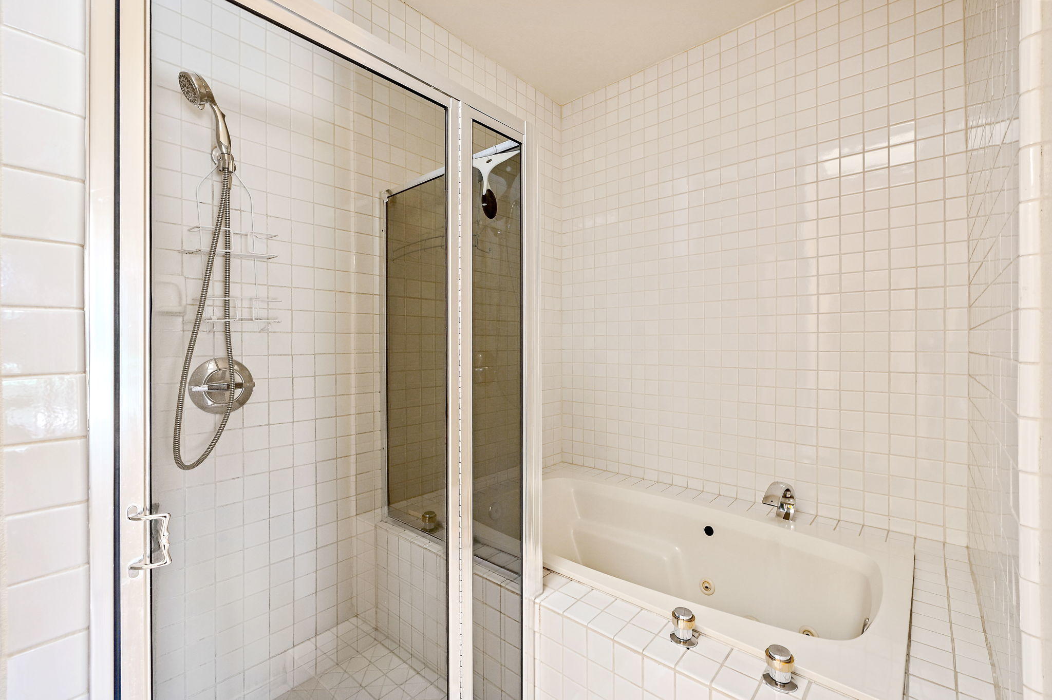 151 Lakeshore Drive Rancho Mirage, CA 92270 - Photo 15 of 37 a bathroom with a bathtub and shower