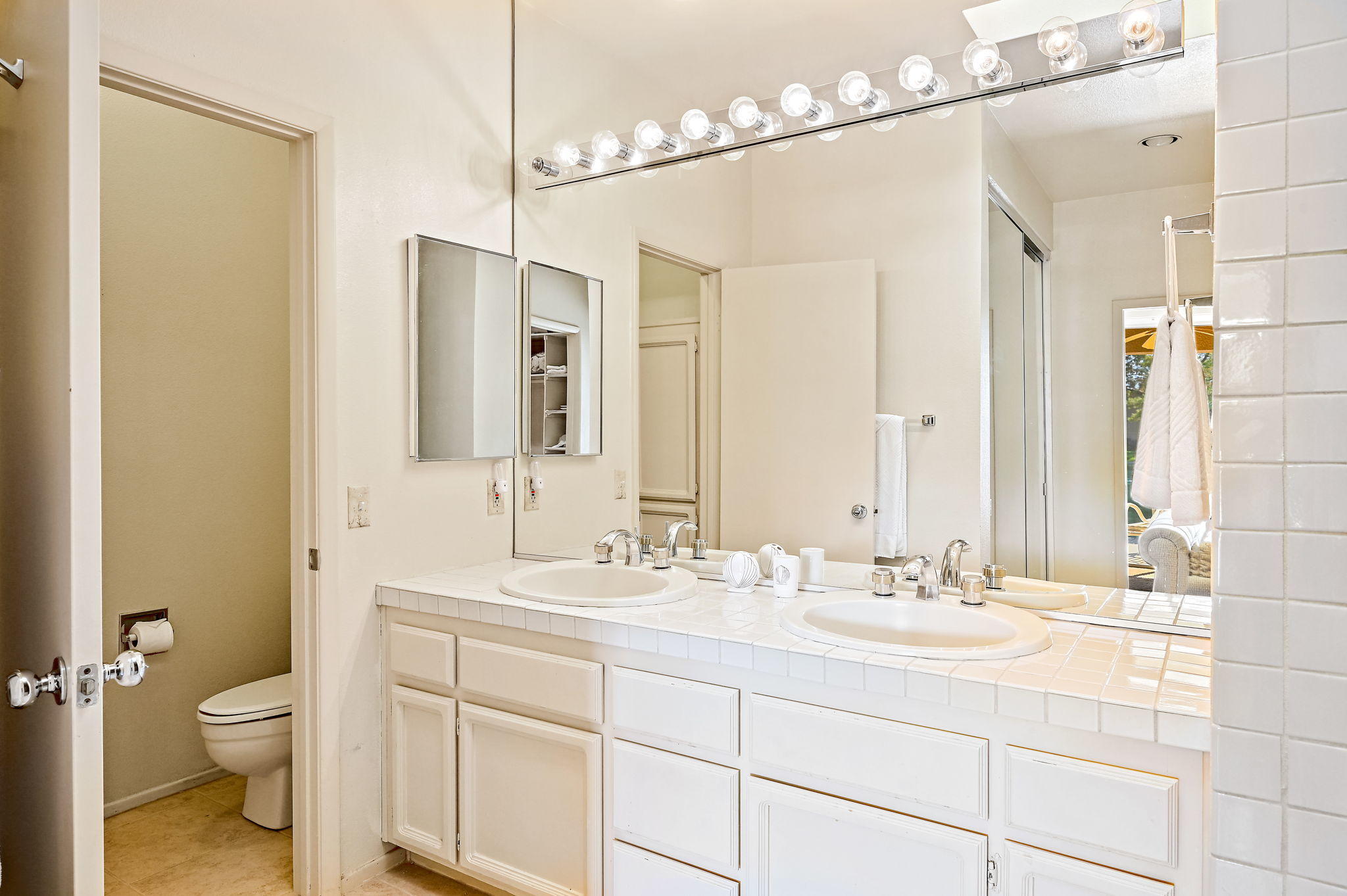 151 Lakeshore Drive Rancho Mirage, CA 92270 - Photo 16 of 37 a bathroom with a sink double vanity and a mirror