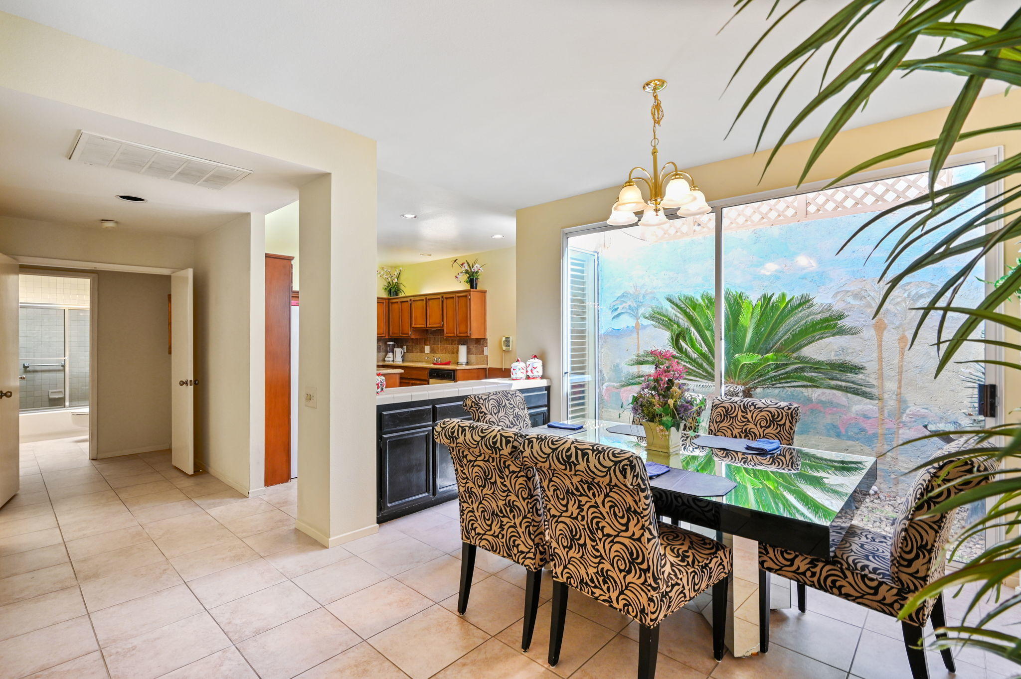 151 Lakeshore Drive Rancho Mirage, CA 92270 - Photo 17 of 37 a dining room with furniture and a floor to ceiling window