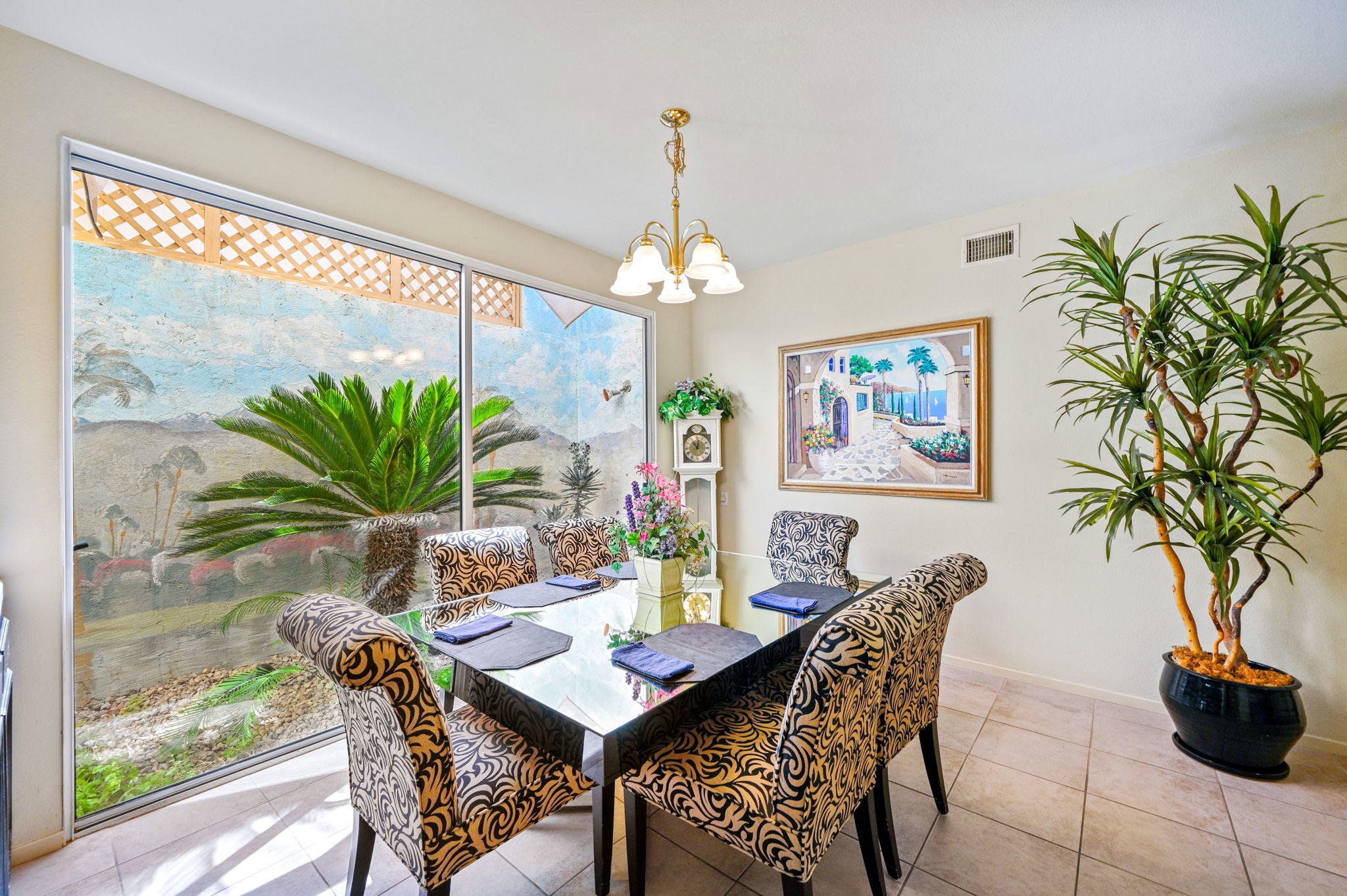 151 Lakeshore Drive Rancho Mirage, CA 92270 - Photo 18 of 37 a dining room with furniture and a chandelier