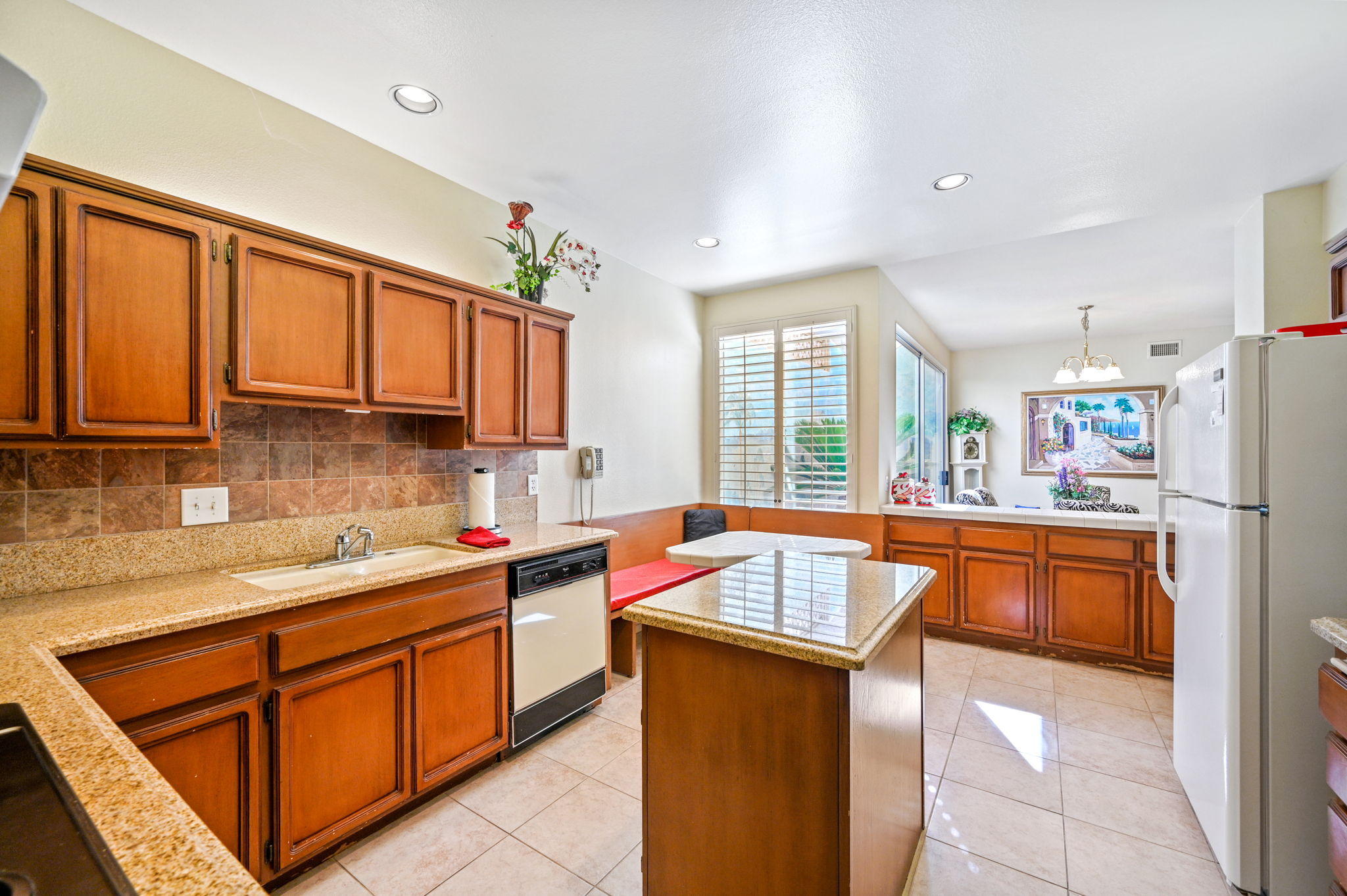 151 Lakeshore Drive Rancho Mirage, CA 92270 - Photo 22 of 37 a kitchen with stainless steel appliances granite countertop a sink stove and refrigerator
