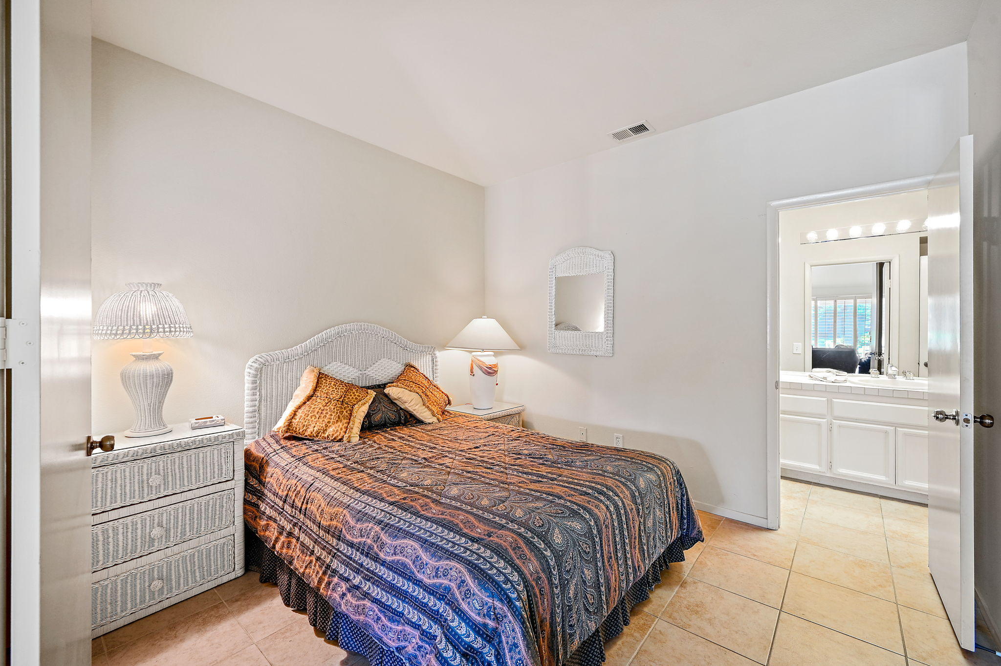 151 Lakeshore Drive Rancho Mirage, CA 92270 - Photo 23 of 37 a bedroom with a bed and a mirror