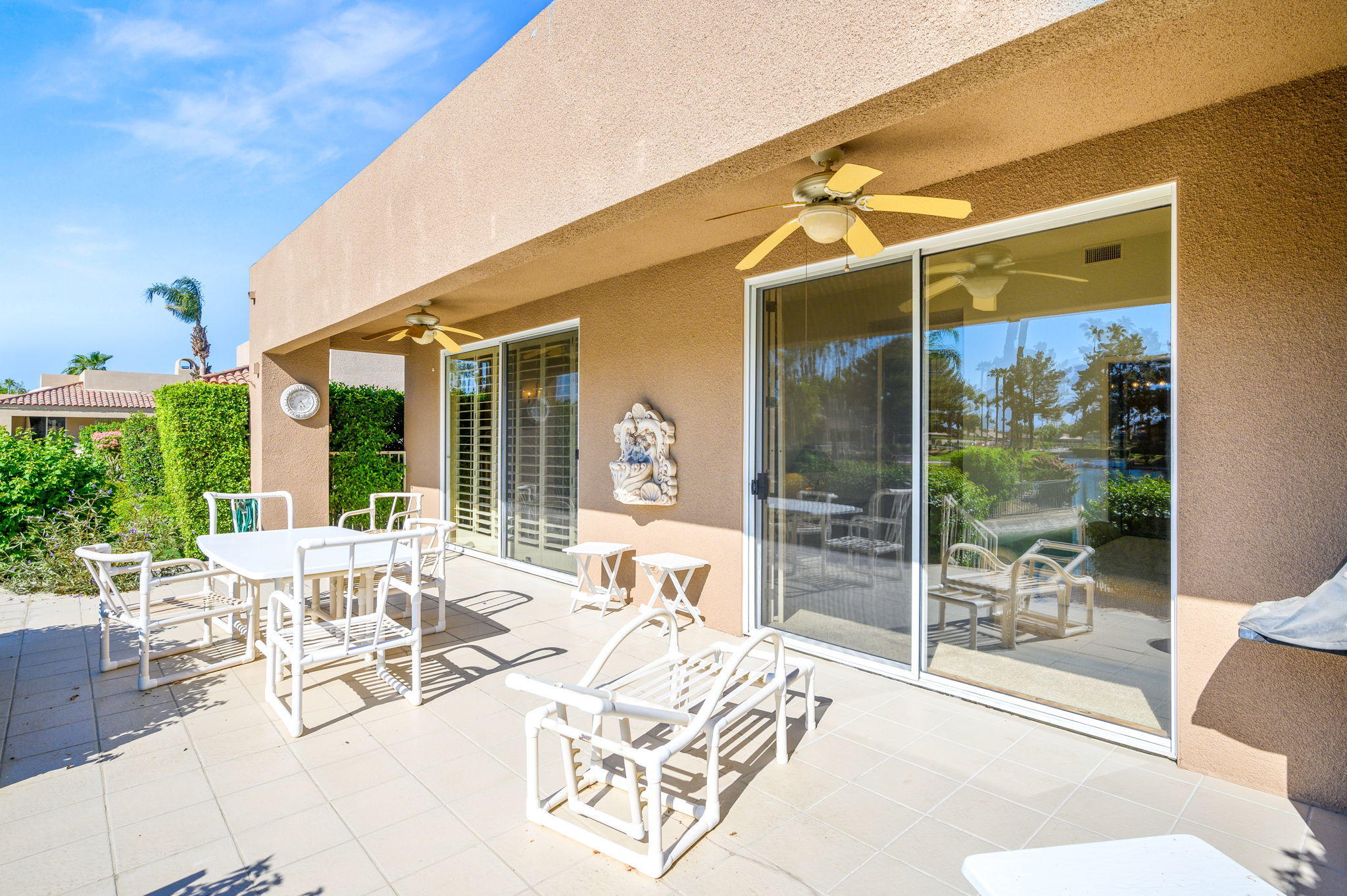 151 Lakeshore Drive Rancho Mirage, CA 92270 - Photo 27 of 37 a view of a patio with a table and chairs