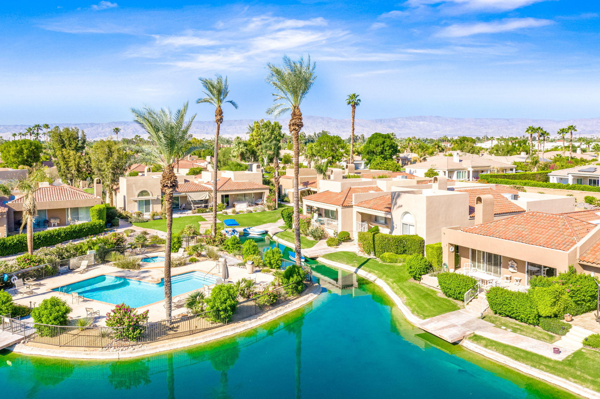 151 Lakeshore Drive Rancho Mirage, CA 92270 - Photo 30 of 37 a view of a lake with a building in the background