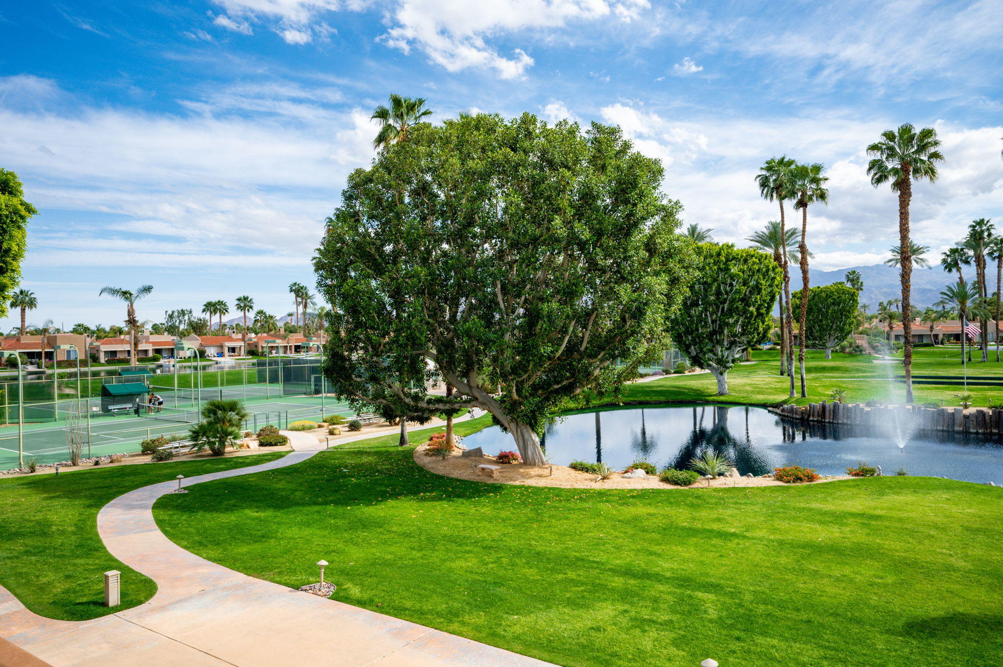 151 Lakeshore Drive Rancho Mirage, CA 92270 - Photo 34 of 37 a view of a garden with houses