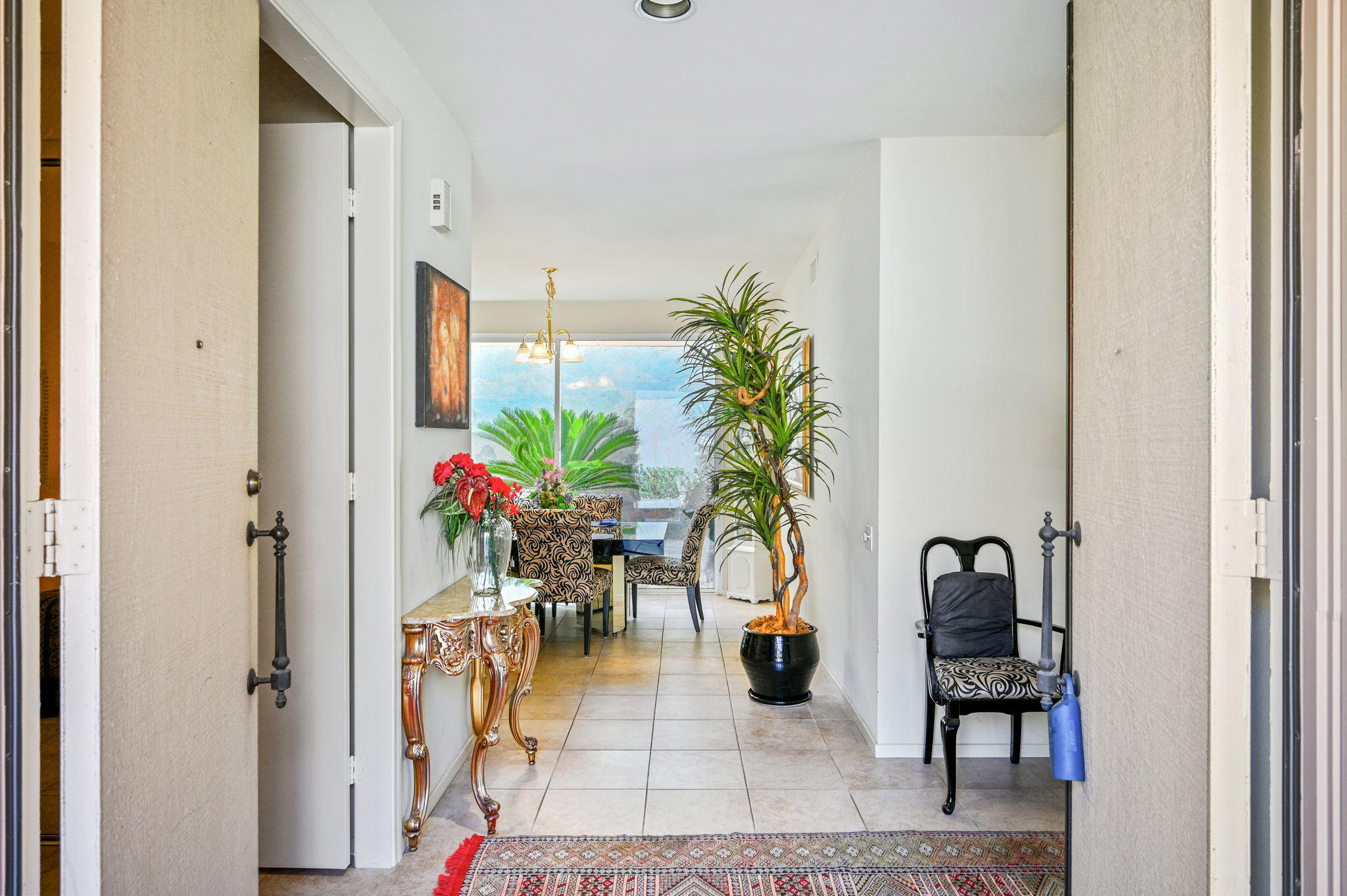 151 Lakeshore Drive Rancho Mirage, CA 92270 - Photo 5 of 37 a view of a hallway with dining area and entryway