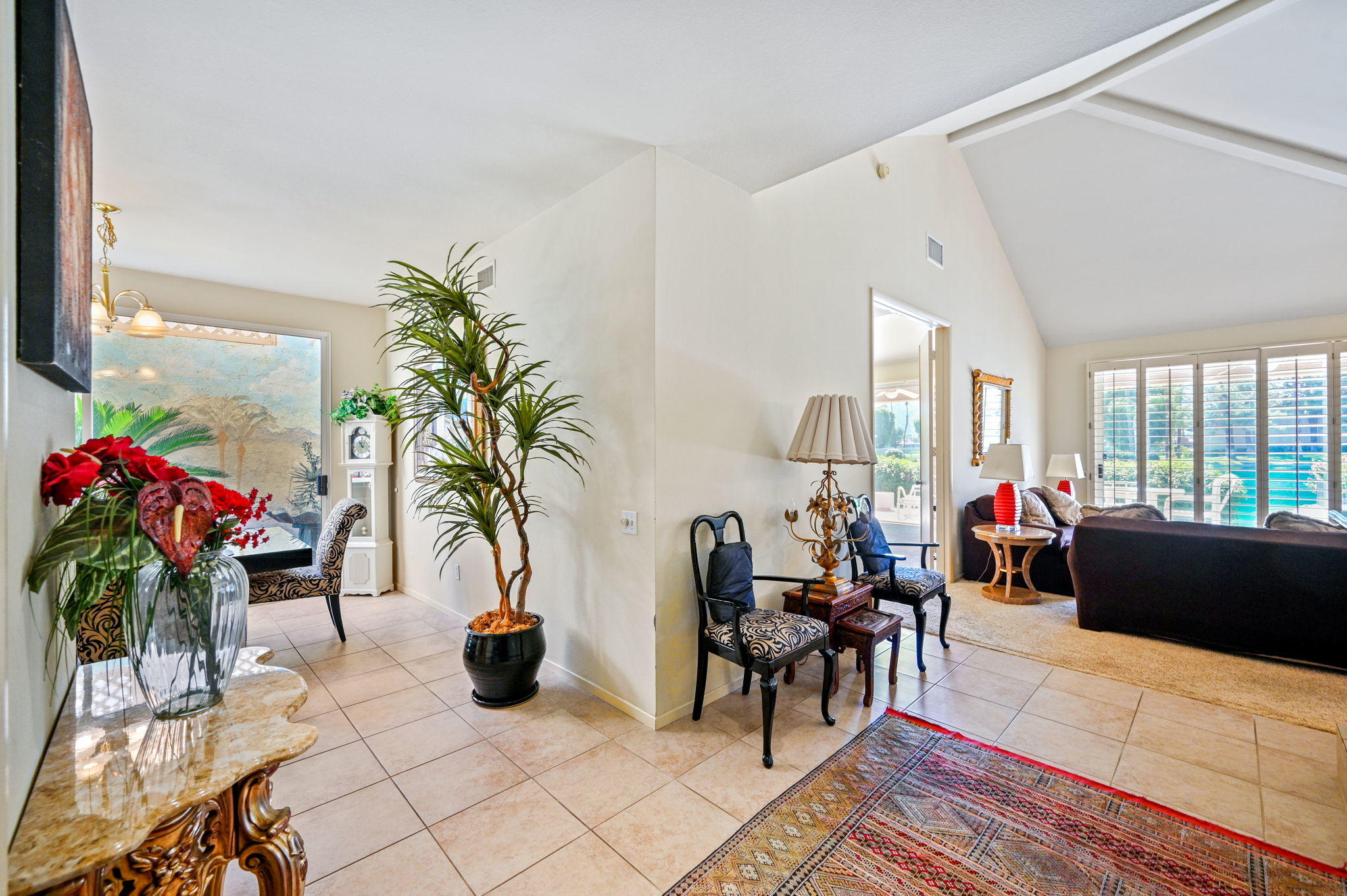 151 Lakeshore Drive Rancho Mirage, CA 92270 - Photo 6 of 37 a living room with furniture potted plant and a large window