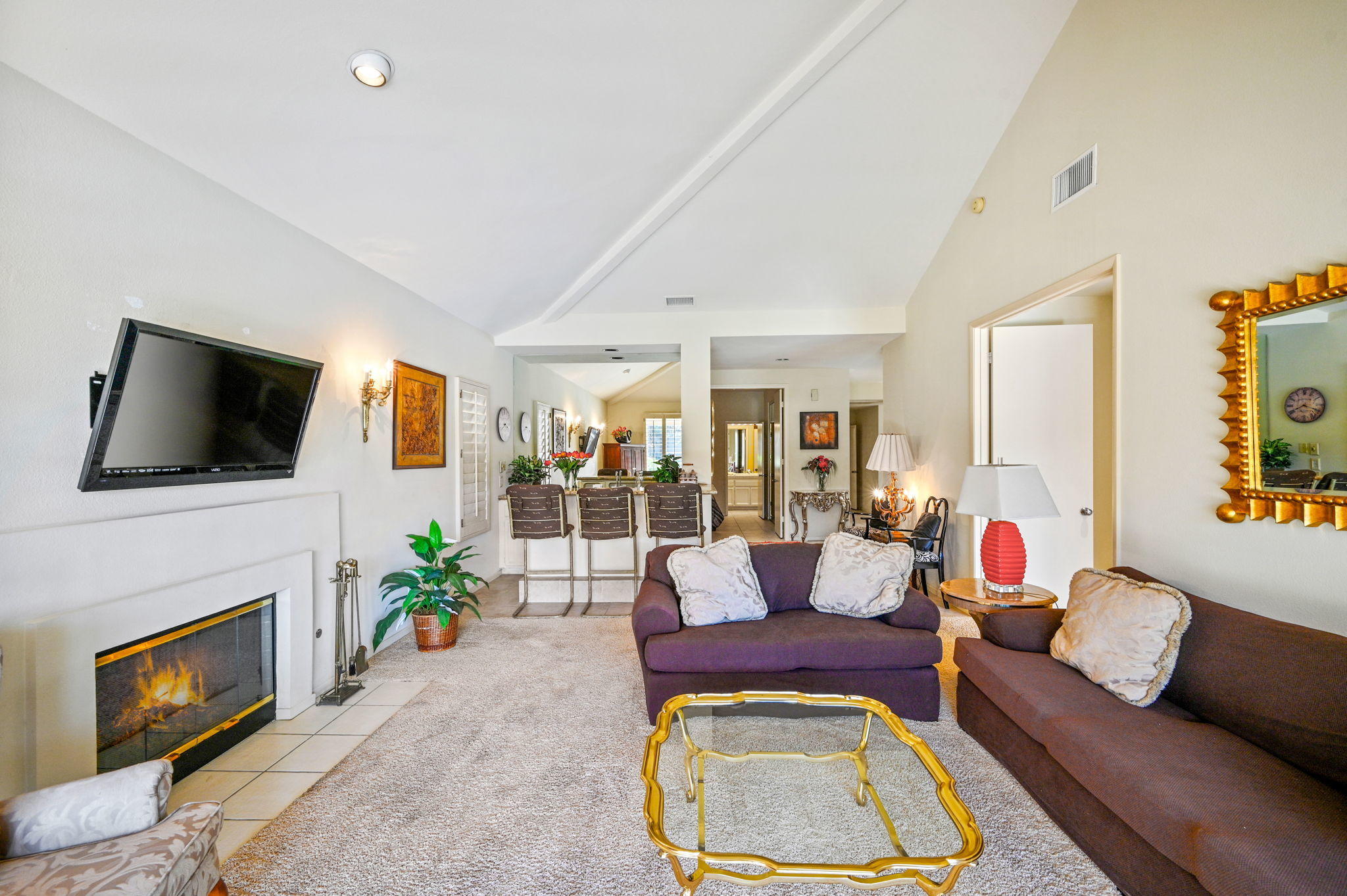 151 Lakeshore Drive Rancho Mirage, CA 92270 - Photo 10 of 37 a living room with furniture fireplace and flat screen tv