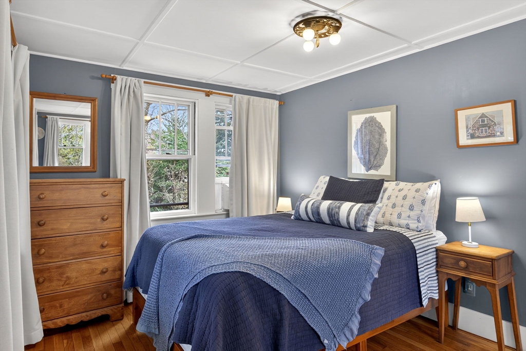 89 Rock Harbor Road Orleans, MA 02653 - Photo 24 of 39 a bedroom with a bed and a dresser