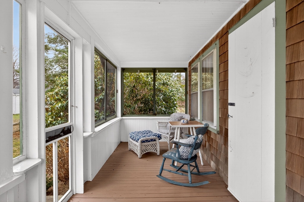 89 Rock Harbor Road Orleans, MA 02653 - Photo 28 of 39 a living room with furniture and a large window