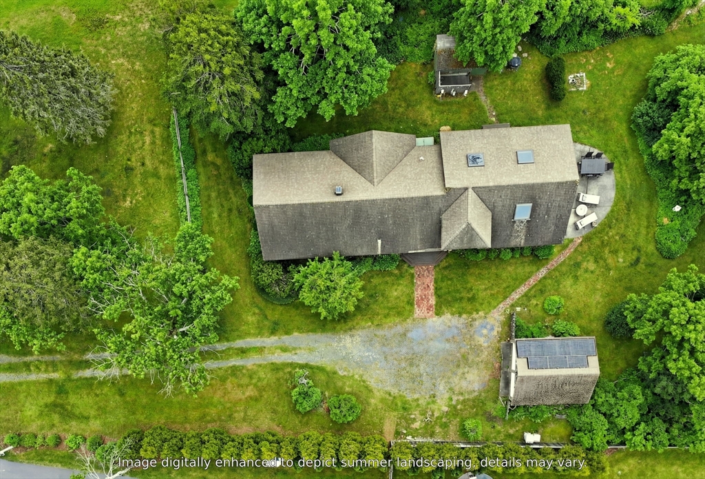 89 Rock Harbor Road Orleans, MA 02653 - Photo 33 of 39 an aerial view of a house with a yard