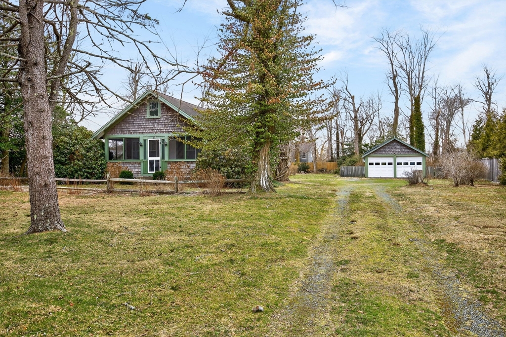 89 Rock Harbor Road Orleans, MA 02653 - Photo 39 of 39 a front view of a house with garden