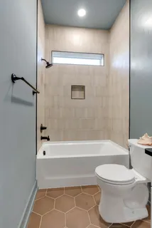 a bed room with a bed and window