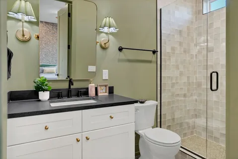 a view of a small space with wooden floor and a window