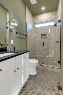 a bedroom with two beds and painted walls